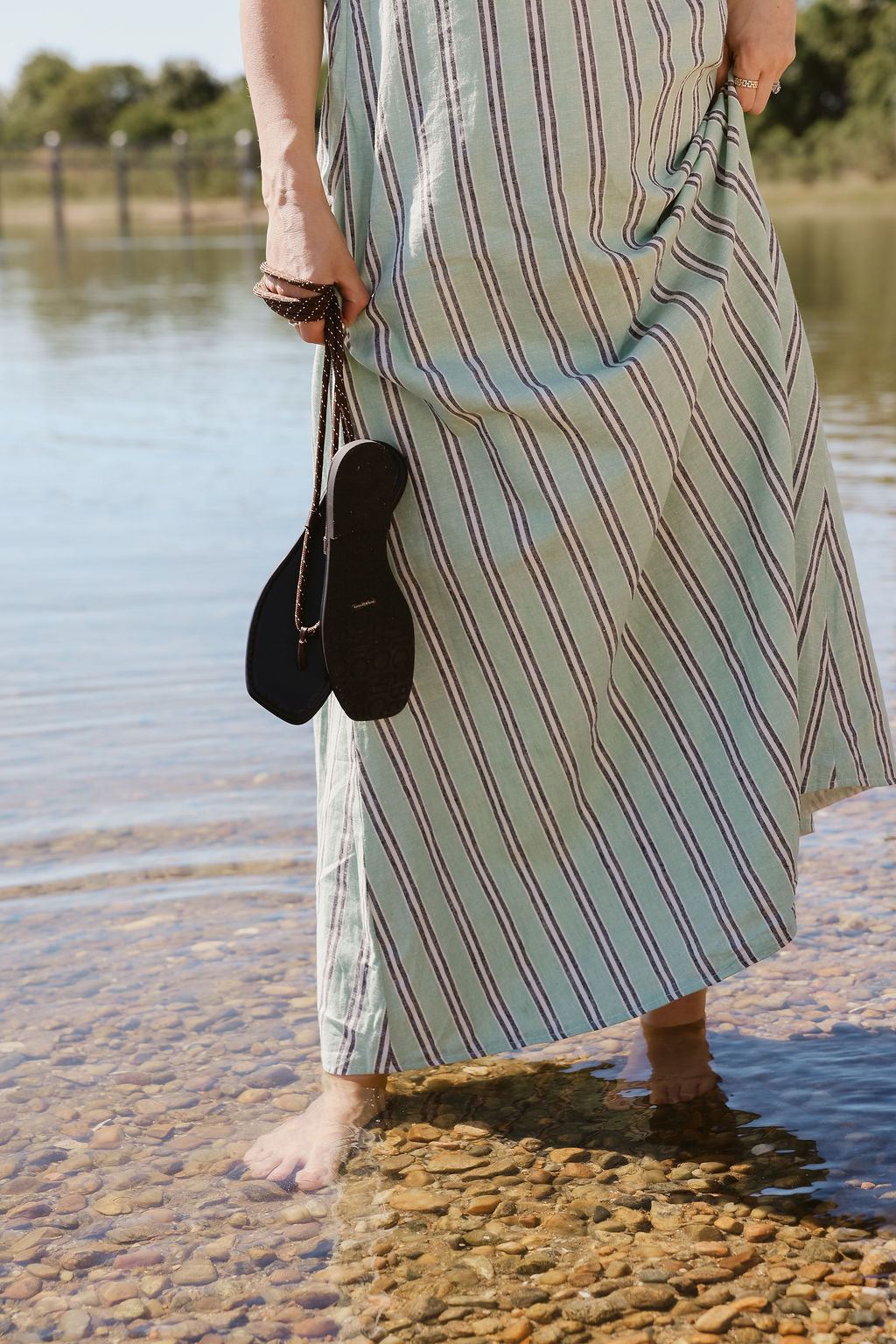 Gili Green Stripe Maxi Dress hem at the water's edge in Montauk — beach maxi dress, stripe dress Nantucket summer look, coastal resort wear