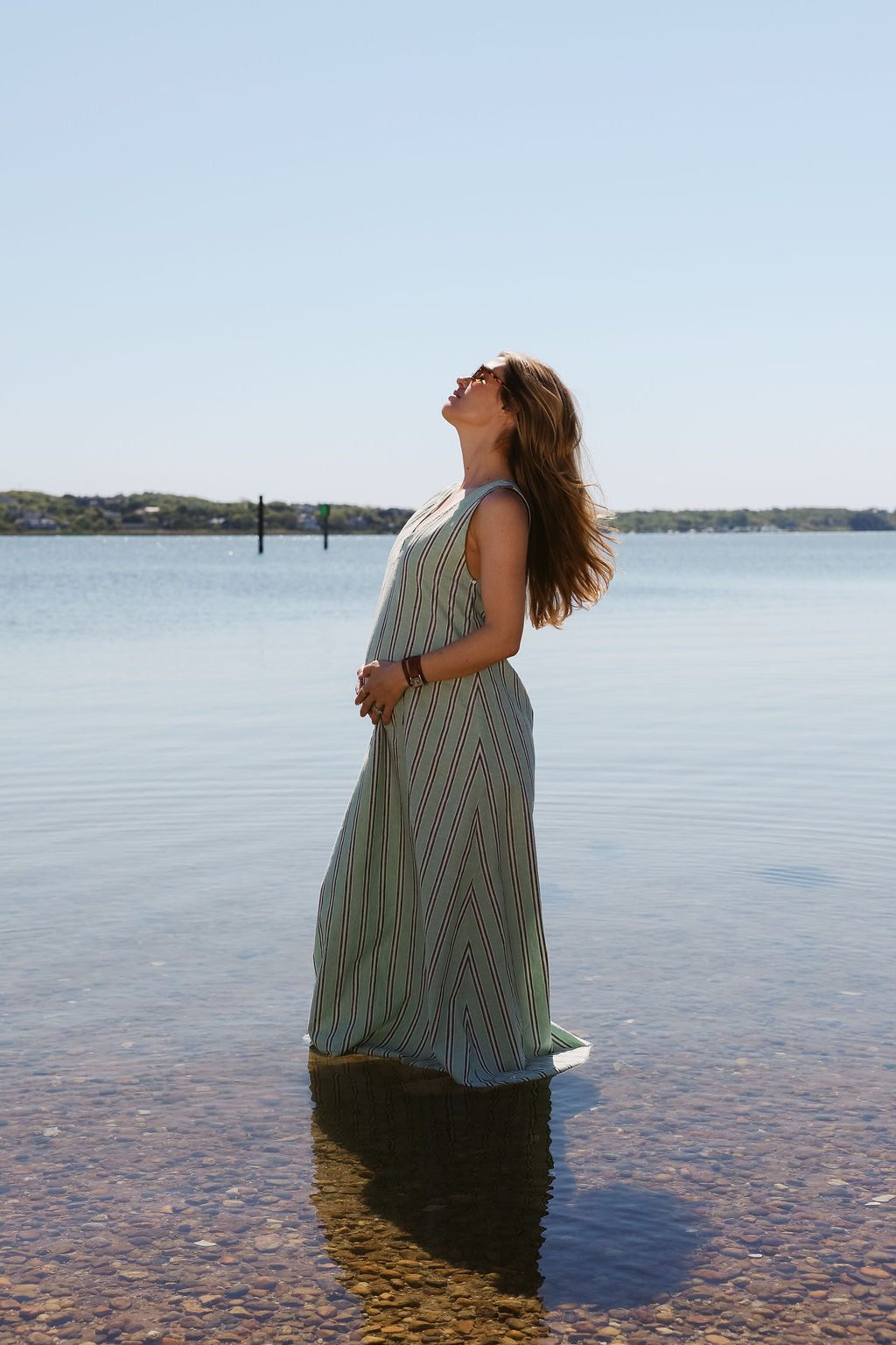 Green stripe Gili Maxi Dress standing in the water at Montauk — ultimate beach maxi dress, nautical stripe dress Southampton Hamptons summer style
