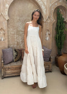 Beige check tiered cotton maxi dress quiet luxury summer outfit 2026, flowy neutral Waverly Dress for vineyard weekend and coastal occasion Puka The Label