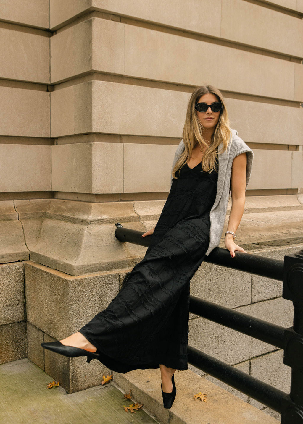 Sophisticated black maxi dress NYC styled — city chic polished Hamptons evening outfit