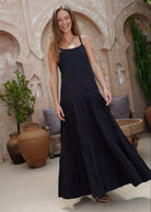 Black tiered cotton Waverly Dress beach vacation and resort wear outfit summer 2026, effortless flowy maxi dress for warm weather travel and coastal getaway