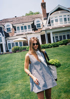 Black gingham mini Gili dress — the perfect boat day and dock cocktails outfit in reversible cotton by Puka The Label