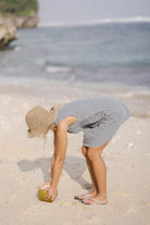 Black gingham mini Gili dress — feminine reversible V-neck style perfect for date night and warm summer evenings