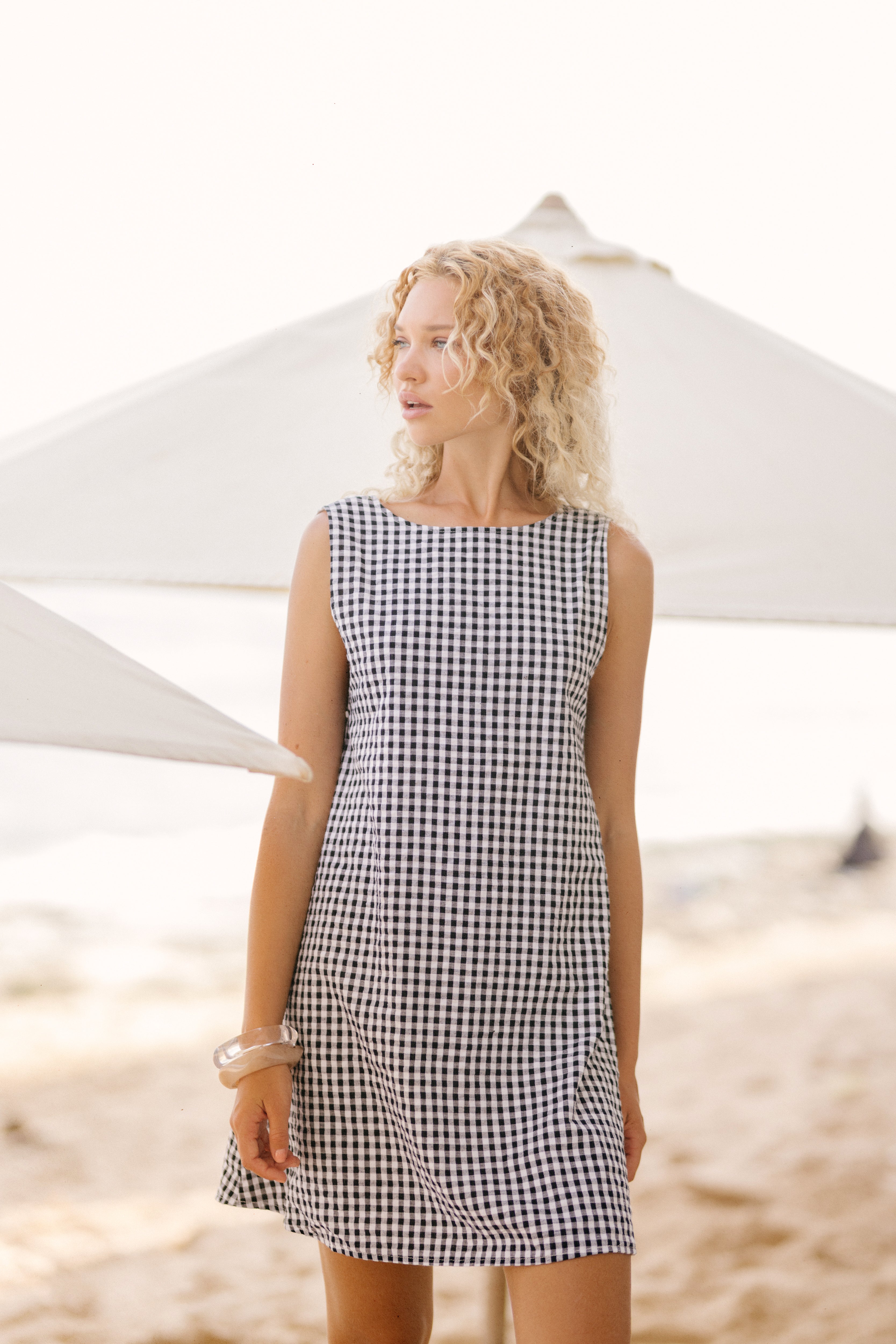 Black gingham mini Gili dress — the perfect Labor Day weekend outfit, reversible for two looks in one by Puka The Label