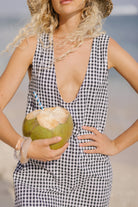 Black gingham mini Gili dress — classic polo match and country weekend outfit in reversible cotton by Puka The Label