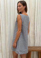 Black gingham mini Gili dress — studio back view of the reversible high neck cotton mini by Puka The Label