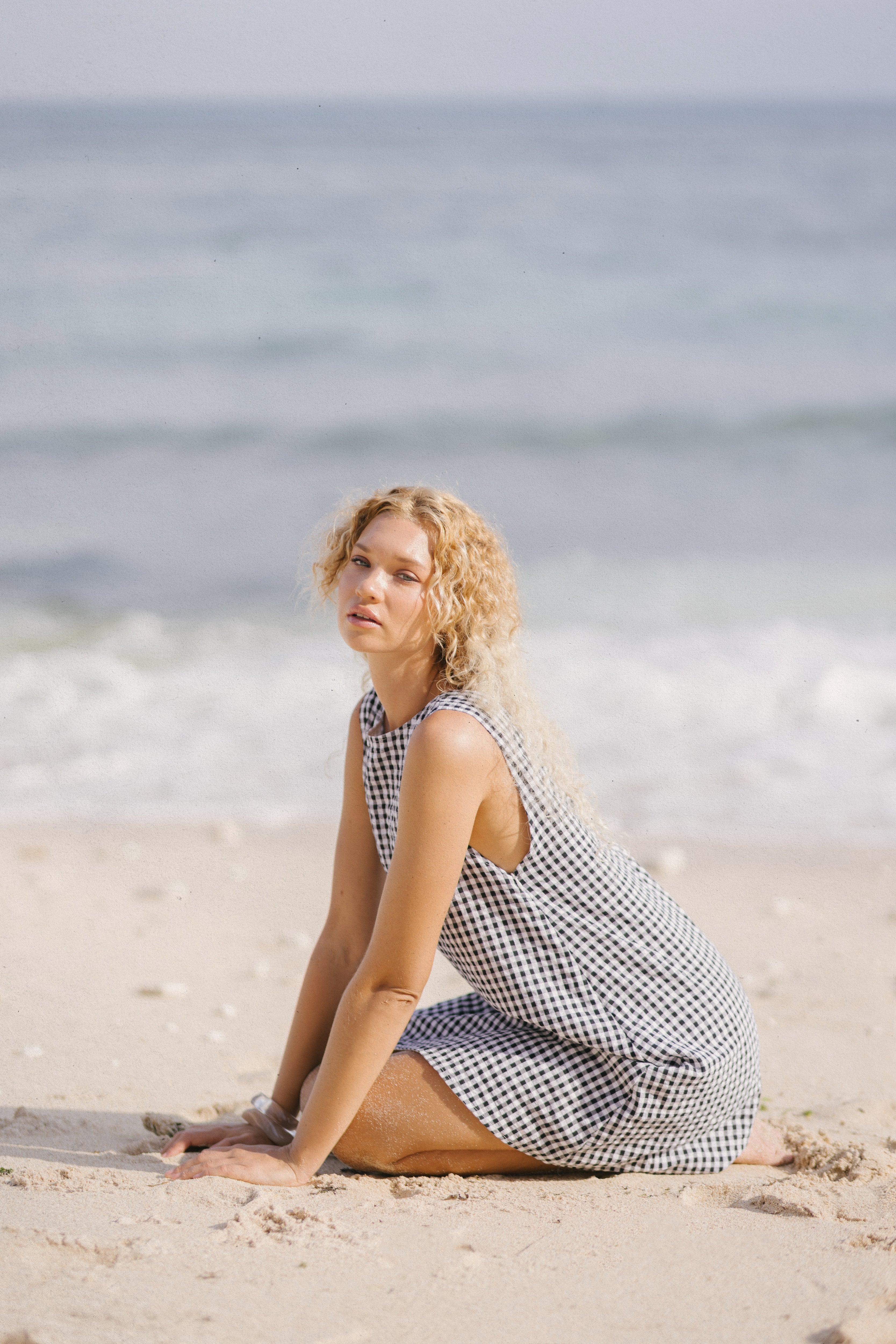 Black gingham mini Gili dress — versatile summer concert and festival outfit, from casual days to coastal chic