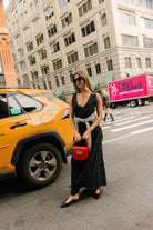 Sophisticated black maxi dress high neck — polished bachelorette trip old money outfit