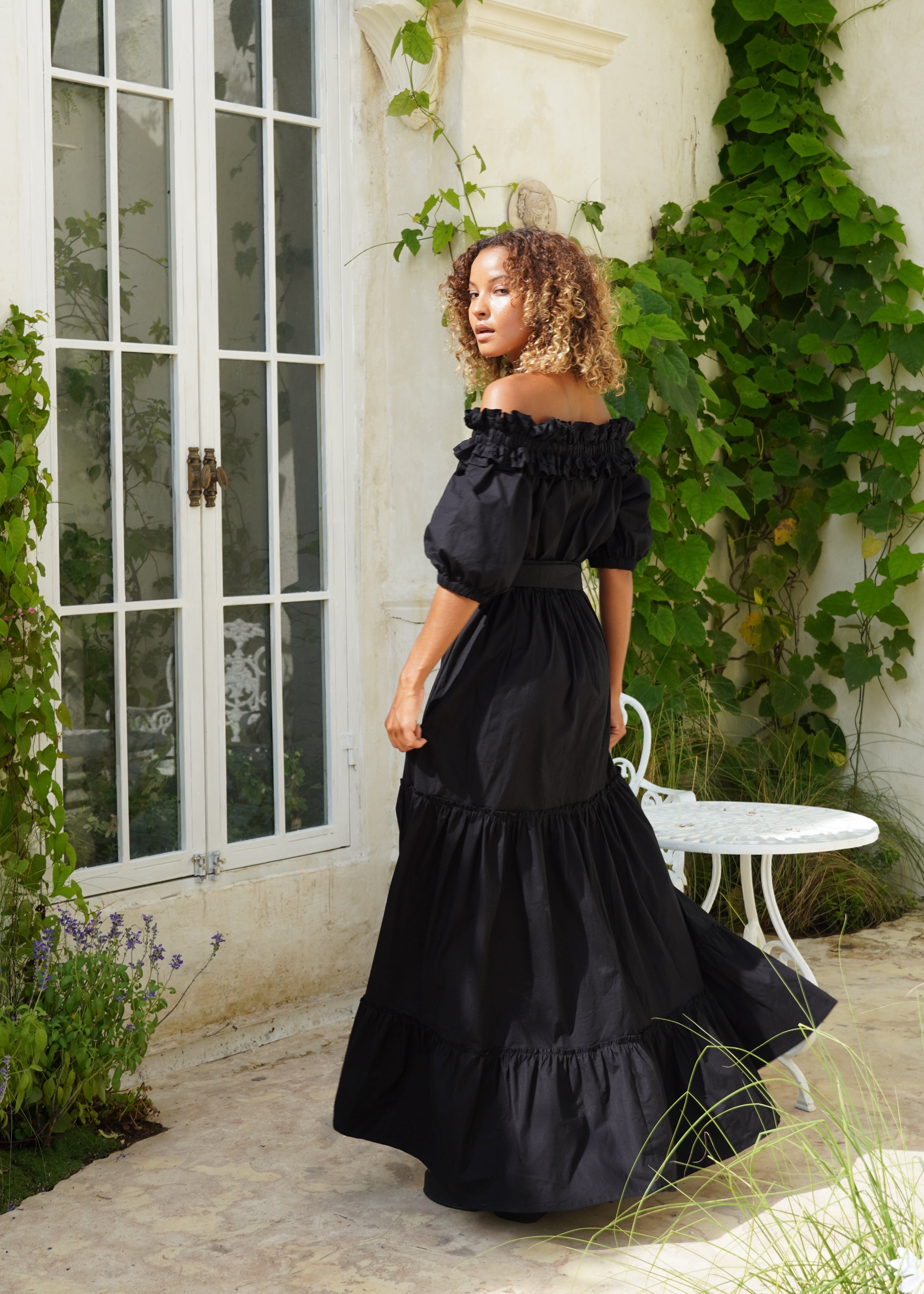 Black off the shoulder maxi dress bachelorette trip outfit idea, chic flowy cotton dress evening vacation party look
