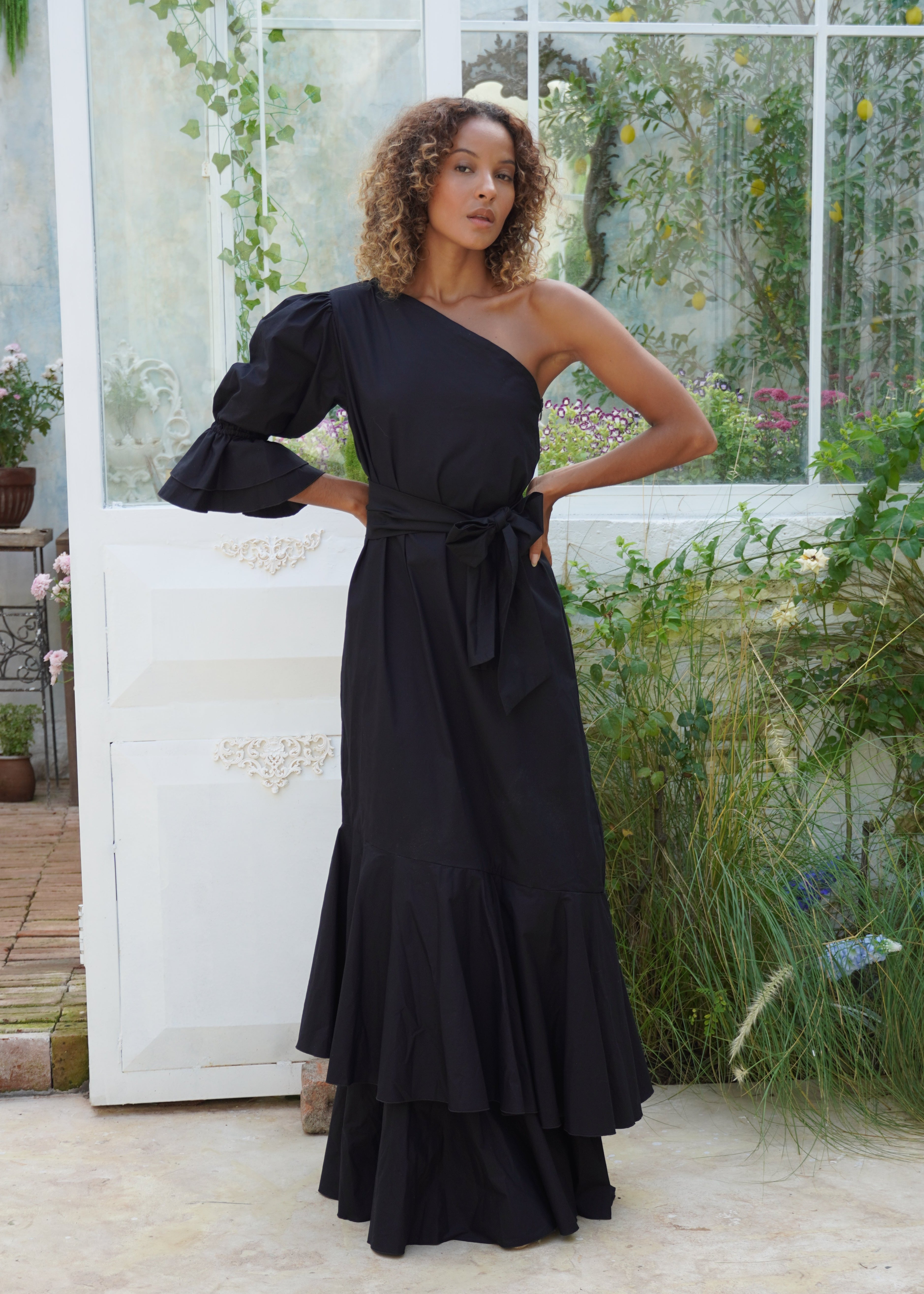 Chic black maxi dress with ruffles and one sleeve for a beach or black tie wedding, sophisticated dresses for parties, elegant maxi dresses that are simple yet stunning