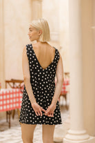 Black and white mini dress 4th of July summer party outfit 2026, fun short cotton dress for rooftop BBQ, lake house, and outdoor celebration
