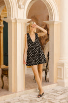 Black and white polka dot short dress Kentucky Derby outfit idea 2026, preppy mini dress for outdoor spring event, garden party, and race day