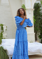 Blue long party dress destination wedding and summer event outfit idea, flowing off the shoulder cotton maxi women 2026
