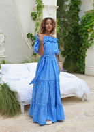Blue wedding guest dress inspiration off the shoulder maxi, flowy cotton tiered dress coastal beach outdoor ceremony 2026