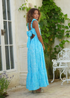 Aqua Bonito ruffle dress — lightweight cotton summer dress with open-back tie, styled for summer parties and brunches