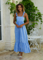 Petal Bonito cotton ruffle dress styled for a summer brunch or beach vacation — easy to wear blue dress for women