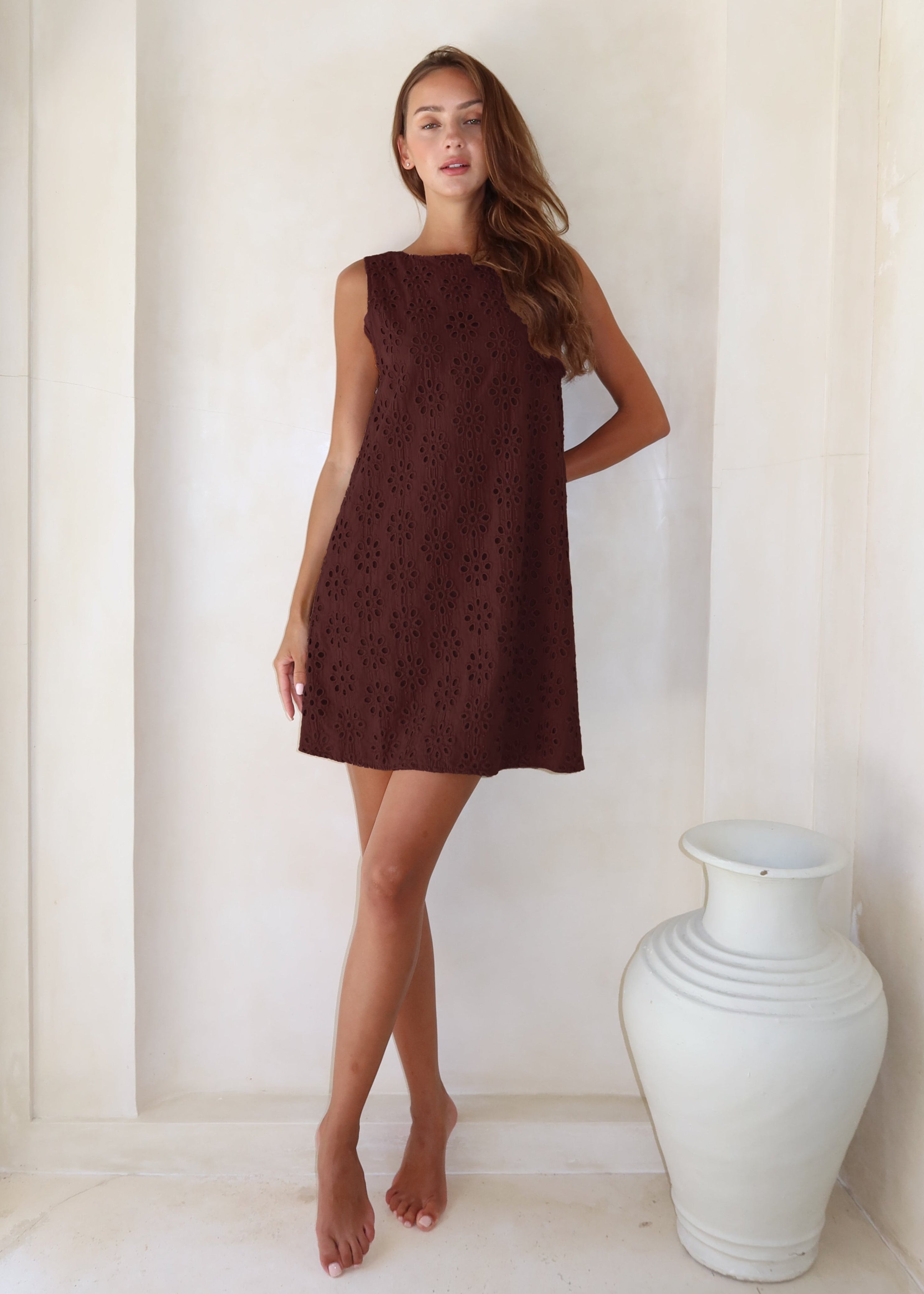 Brown floral eyelet mini dress back view, open reversible neckline detail, chocolate brown cotton, Couper x Puka