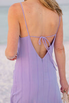 Close-up of purple Charli Dress open back — spaghetti strap back tie detail on Charli Evans x Puka custom-dyed cotton dress