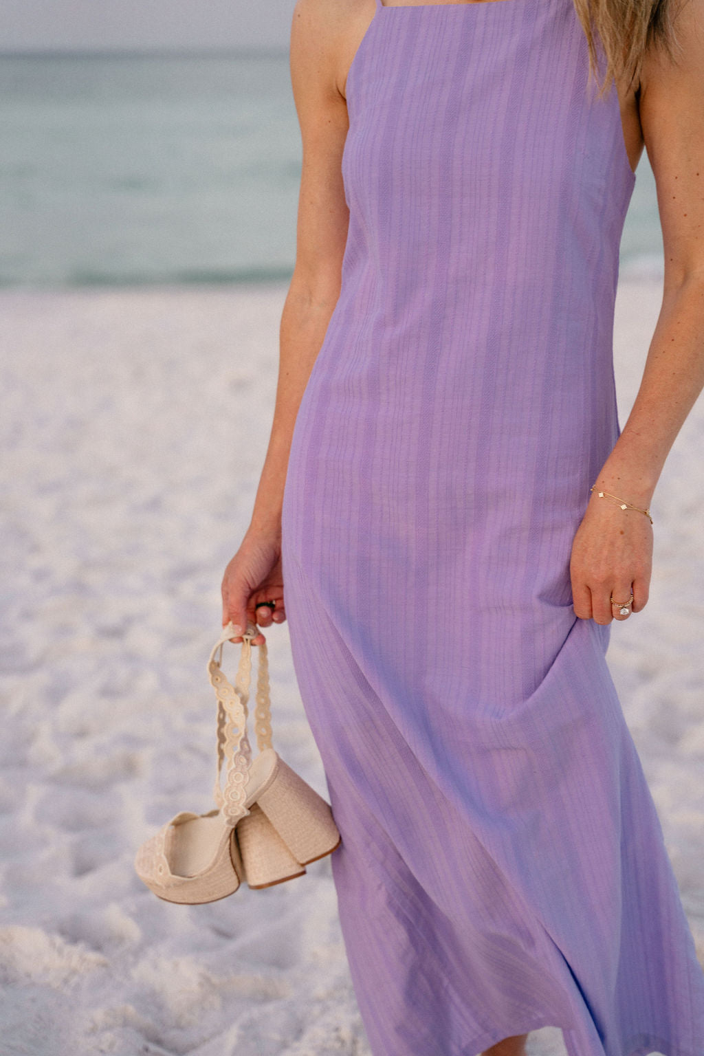 Close-up of purple Charli Dress from waist to hem — side slit and custom-dyed cotton fabric detail, Charli Evans x Puka