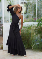 Chic black maxi dress holiday party and rehearsal dinner outfit idea, sophisticated one shoulder ruffle maxi 2026