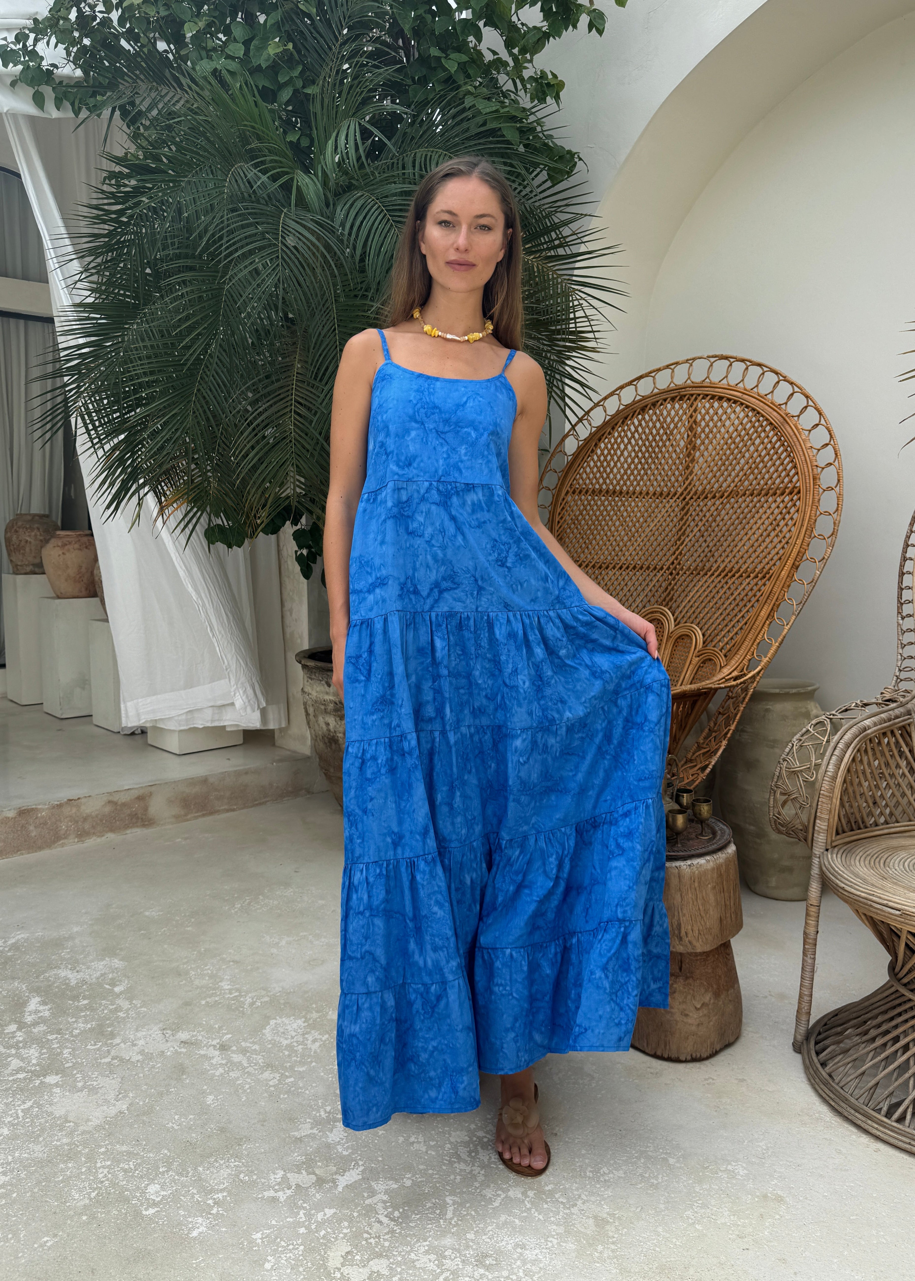 Cobalt blue tiered maxi dress black tie optional summer party outfit 2026, vibrant hand-dyed cotton dress for rooftop celebration and outdoor gala