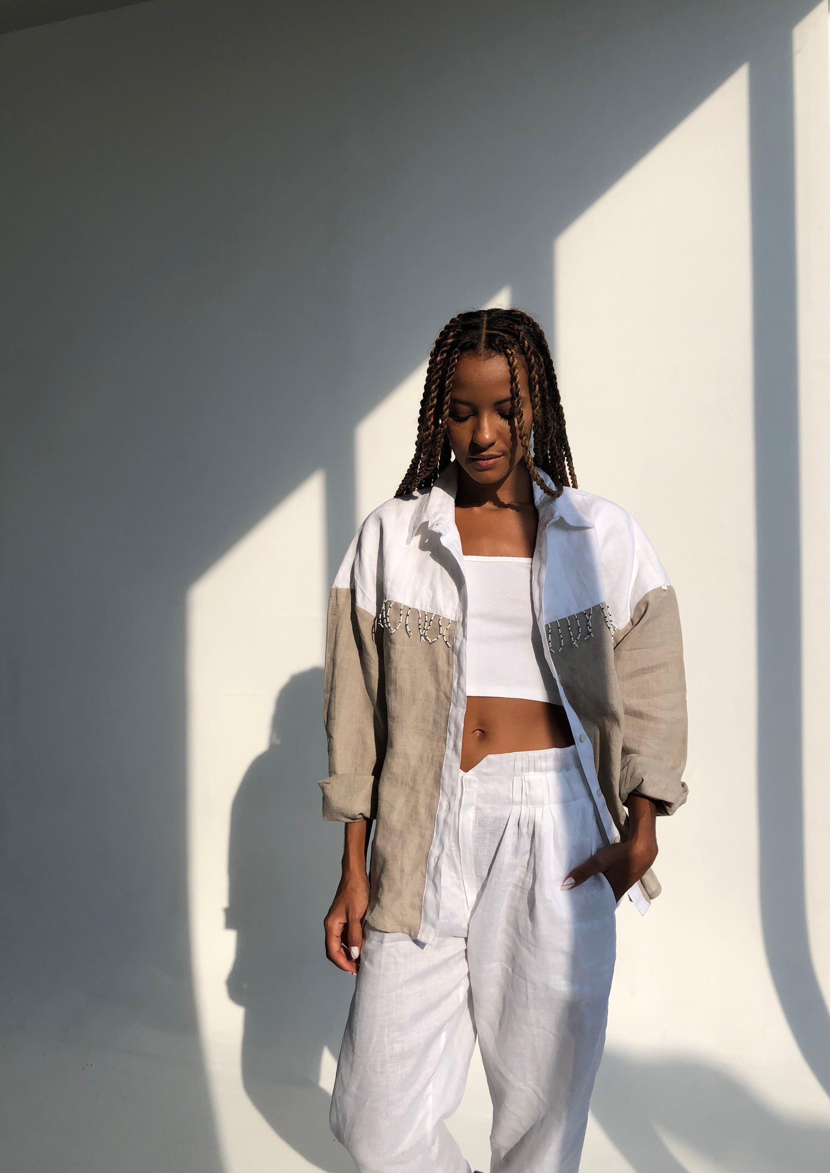 Model wearing Puka The Label color block Ulu fringe button-up — ranch chic western blouse with black and white fringe detail