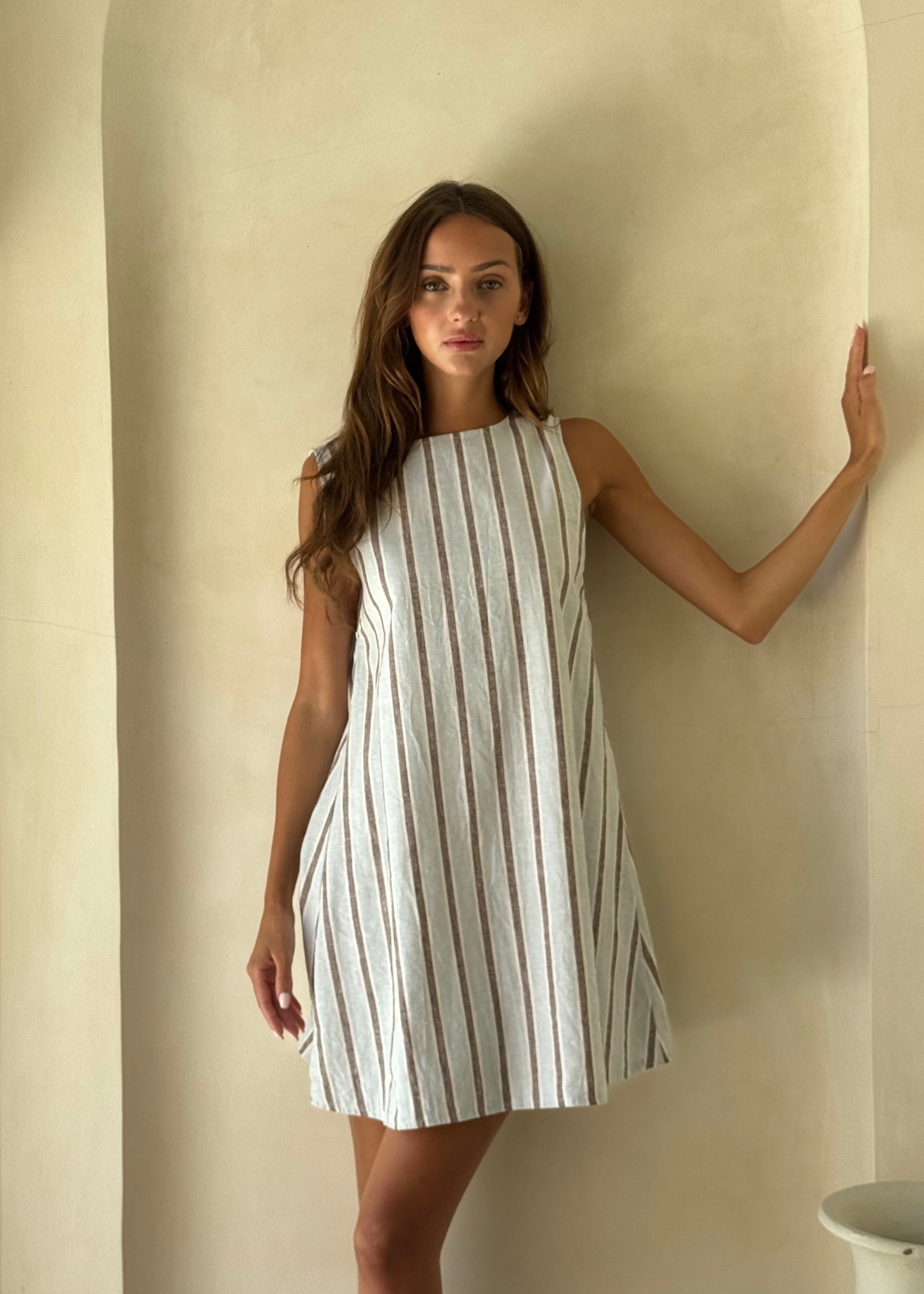 Couper x Puka Exclusive Mini Gili ice blue stripe ghost mannequin flat lay, textured cotton reversible V-neck high neck mini dress Puka The Label 2026