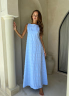 Couper x Puka Exclusive Gili Dress light blue feathered cotton maxi high neck, Santorini Mediterranean resort summer 2026 dress Puka The Label