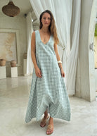 Green gingham maxi dress with V-neckline, easy to wear flowy cotton summer dress for beach vacation, resort wear and baby shower Puka The Label