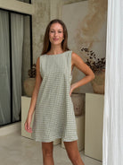 Green gingham mini Gili dress — a fresh, effortless picnic and spring date outfit by Puka The Label