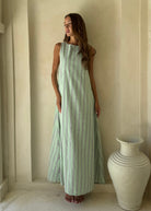 Gili Green Navy and White Stripe Maxi Dress as a resort wear staple, versatile convertible neckline for beach to sunset