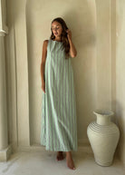 Gili Green Navy and White Stripe Maxi Dress styled as a chic beach coverup for a European summer vacation