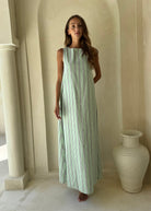 Gili Green and White Stripe Maxi Dress styled for an Amalfi Coast beach day, lightweight and effortless