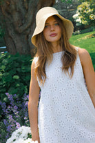 White floral eyelet mini dress Nantucket coastal spring outfit 2026, preppy cotton Mini Gili dress for East Coast beach town and harbor occasion