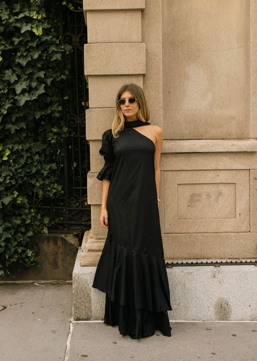 Black Chic Long Ruffle Wedding Guest Dress on Jules Fox (julessfoxx) styled in NYC. Influencer Jules Fox julessfoxx wearing black ruffle maxi dress in New York City, chic NYC street style evening look