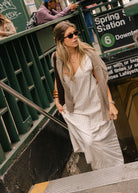 Jules Fox NYC city chic style — beige gingham maxi layered with sweater, easy elegant fall city outfit, Puka The Label