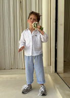 Light blue gingham boys pants Pantai Pant by Puka The Label, kids coastal beach resort outfit