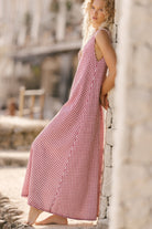 Maroon gingham Gili maxi dress in movement — perfect picnic dress and outdoor summer style, Puka The Label