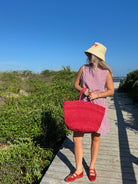 influencer meredith wyche wears a cute short red gingham dress in the summer in SC