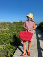 influencer meredith wyche wears a cute short red gingham dress in the summer in SC