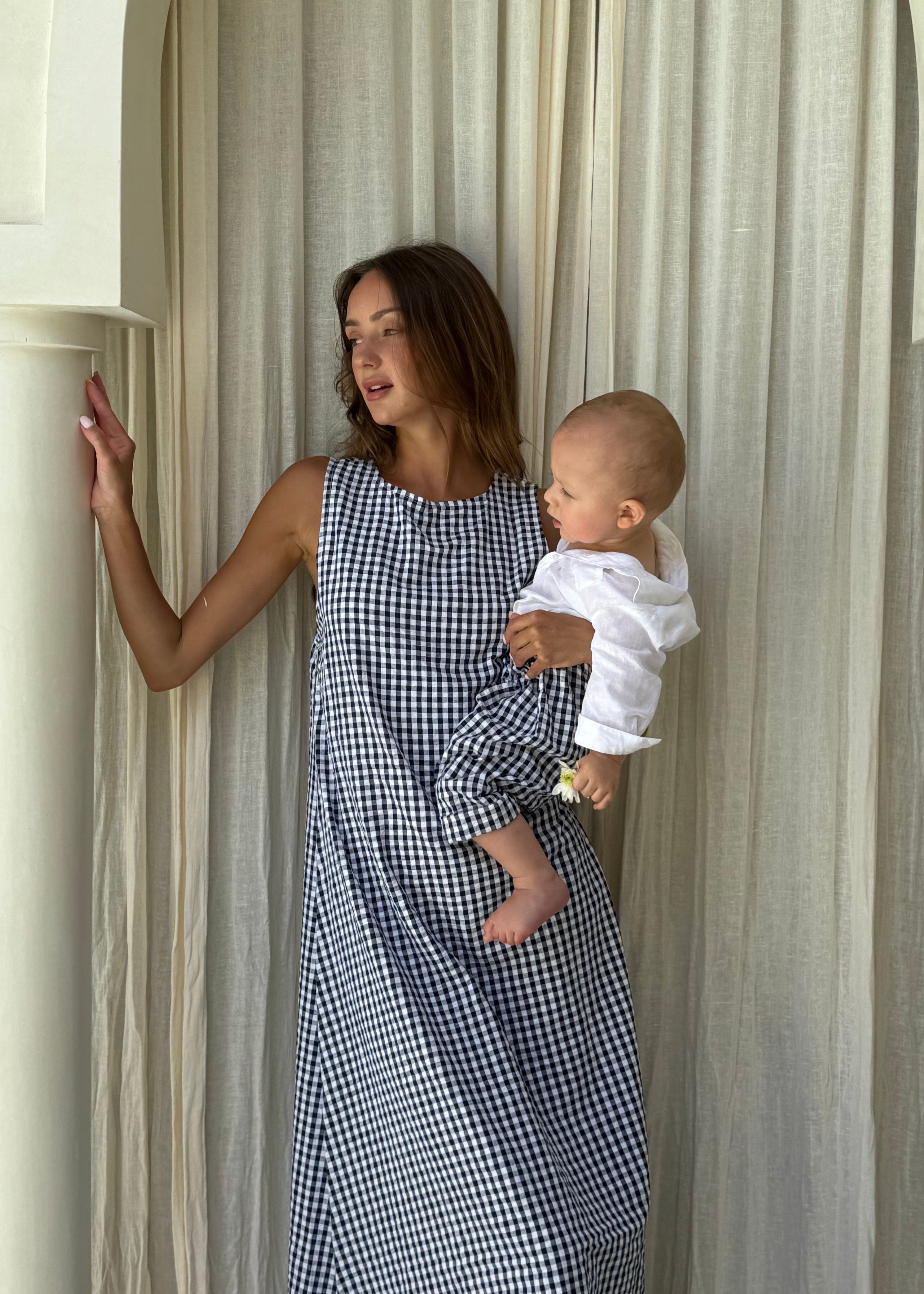 Mommy and me matching navy gingham outfits, mother and son coordinating summer look family photo idea 2026. Slightly matching mommy & me outfits spring