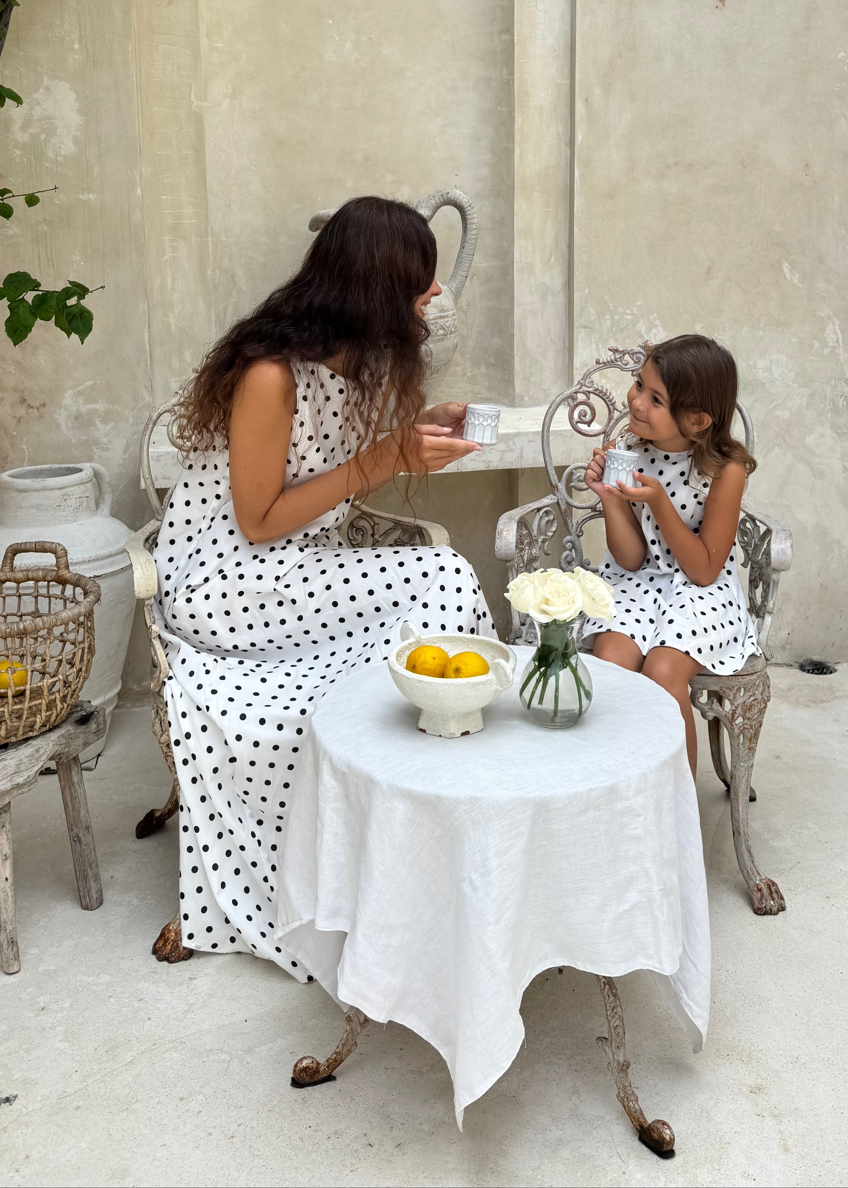 (Mommy & Me shot) Mommy and me matching polka dot dresses Easter 2026, mother daughter spring outfit idea, coordinating cotton maxi and mini dress for family photos
