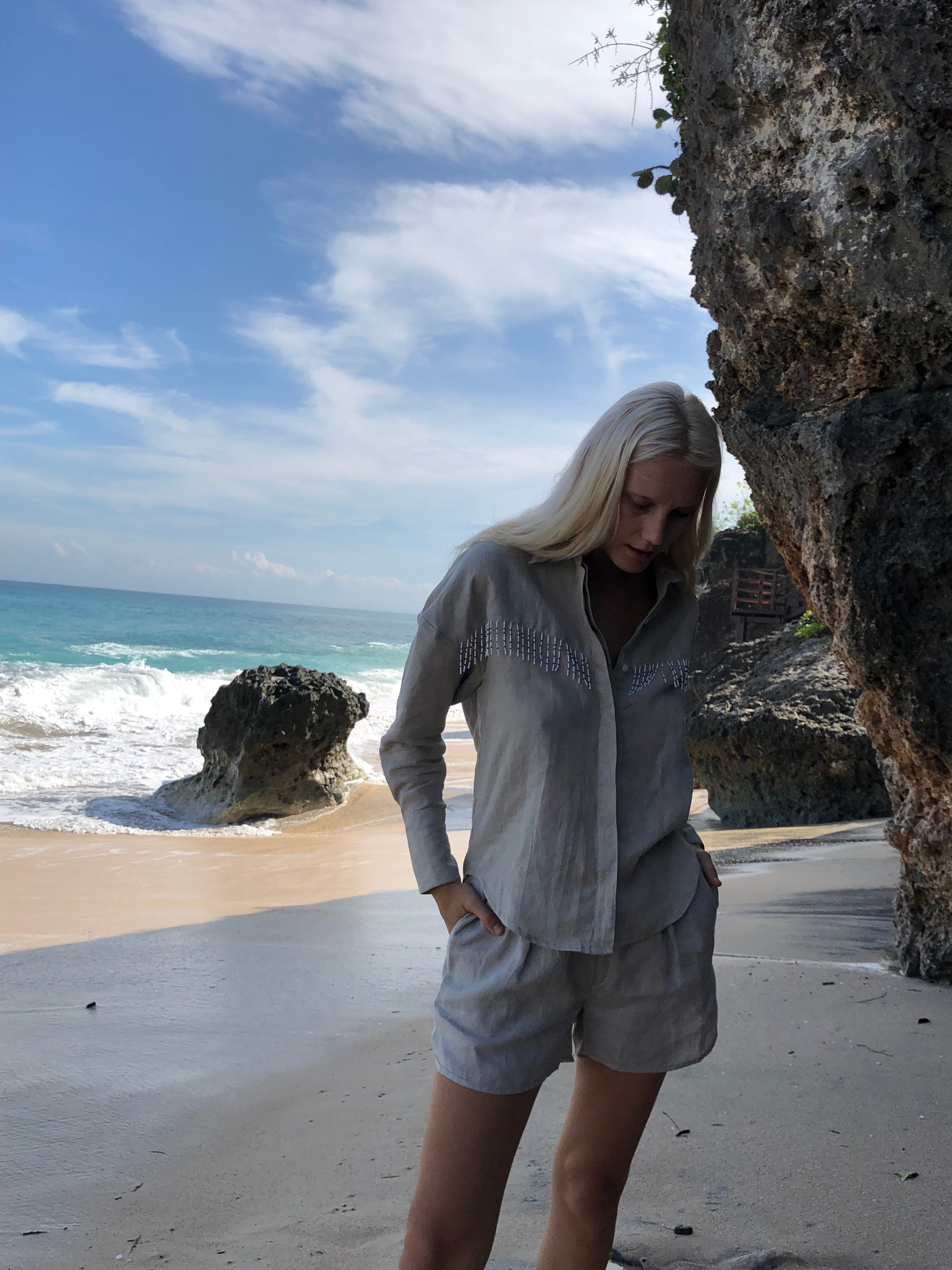 Natural linen fringe blouse from Puka The Label — an elevated western button-up with black and white fringe for fall occasions