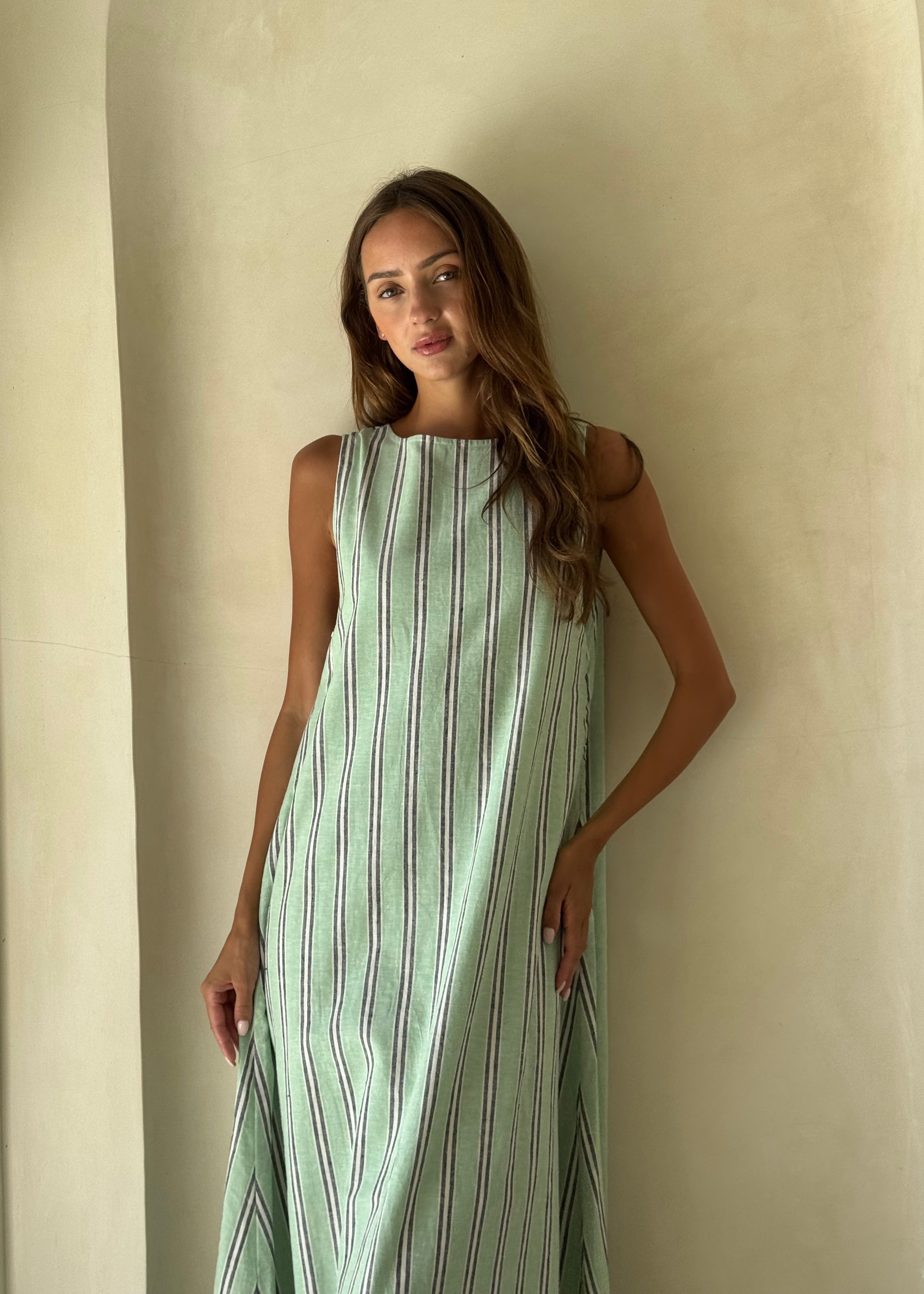 Gili Stripe Maxi Dress in navy and white worn as a relaxed resort wear look for a coastal summer getaway