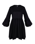 Nori Dress black ghost mannequin flat lay, oversized ruffle sleeve cotton mini dress with button closure 95% cotton 5% spandex Puka The Label 2026