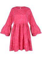Nori Dress pink ghost mannequin flat lay, hand-dyed ruffle sleeve oversized cotton mini dress button closure neckline 100% cotton Java Puka The Label 2026