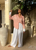 Puka The Label peach Ulu fringe top styled ranch-to-resort — a versatile western button-up blouse for spring and travel