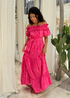 Bright pink dress girl gender reveal outfit idea, off the shoulder flowy cotton maxi dress bump friendly celebration look 2026