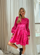 Pink hand-dyed cotton ruffle sleeve mini dress bridal shower outfit spring 2026, playful feminine dress for outdoor celebration and garden party