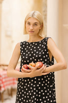 Polka dot mini dress tea party outfit idea spring 2026, feminine short cotton dress for garden brunch, bridal shower, and Mother's Day celebration
